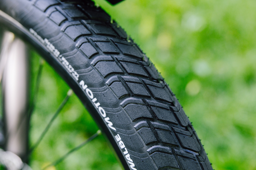 Schwalbe Pneu Motion Big Apple 28x2.15 Addix Green starr mit Reflexstreifen black